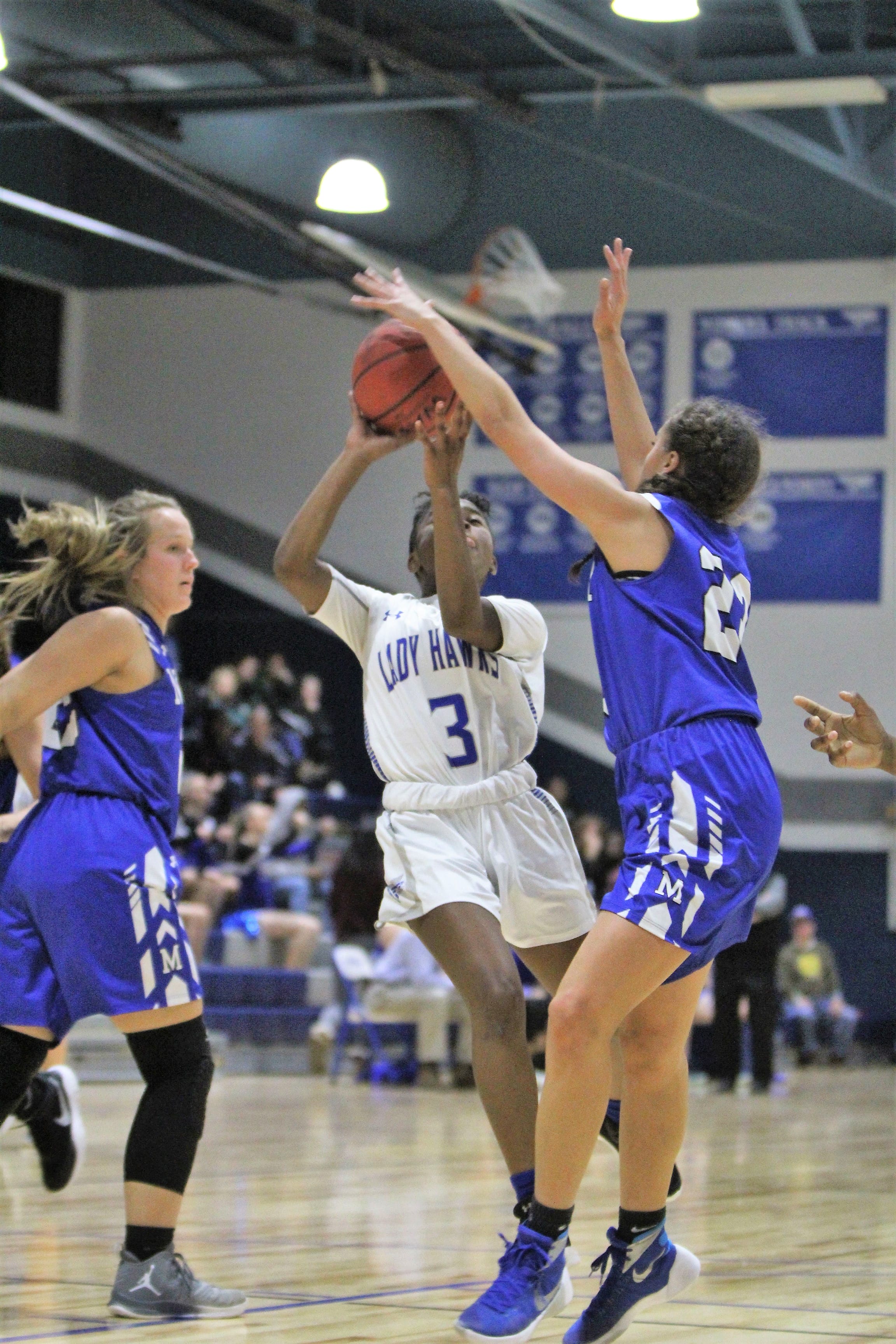 Lady Raiders hold off Hawks