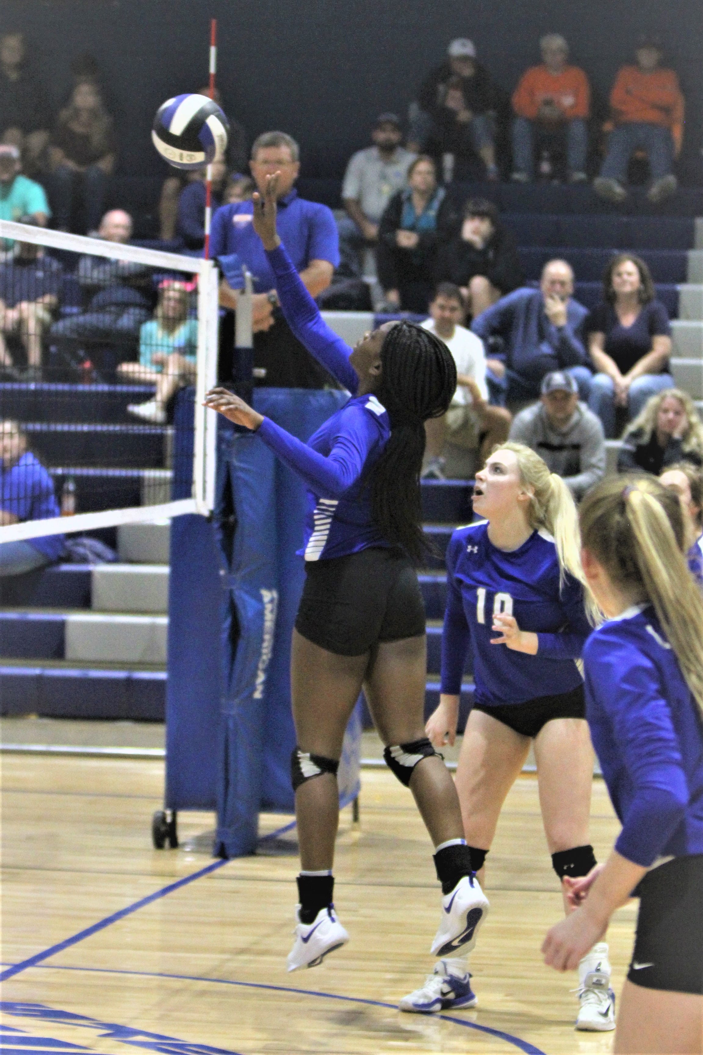 Cavs squeak past Hawks in volleyball