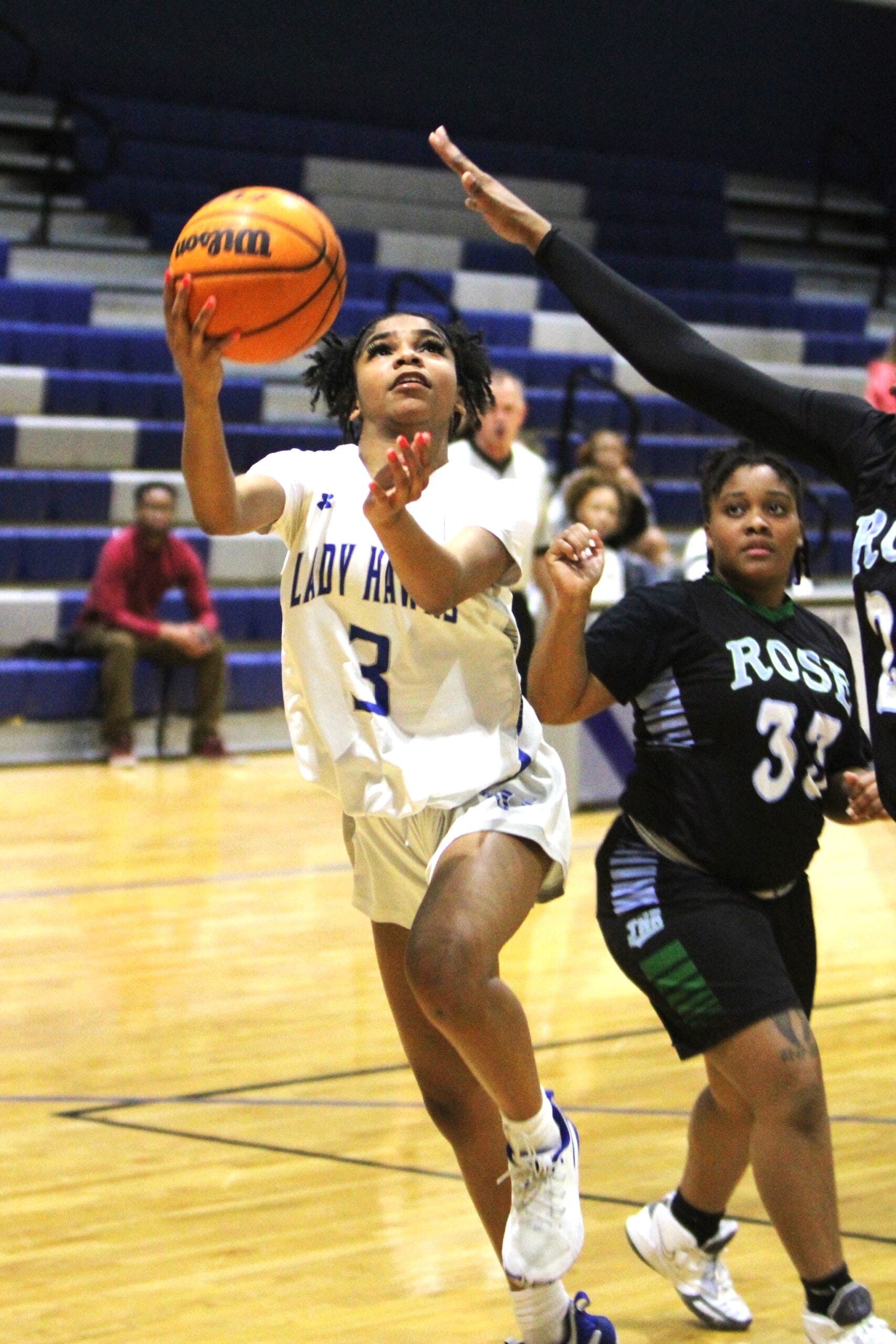 Lady Hawks surge into second round by downing Rose Rampants, 65-31